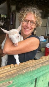 Tania holding a goat