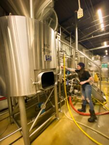 Alaina Kewitt explains how the purposes of different tanks in Second Self's brewing warehouse.