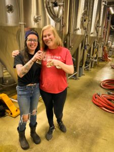 Alaina Kewitt and Carly Tritley cheers at Second Self Beer Co.